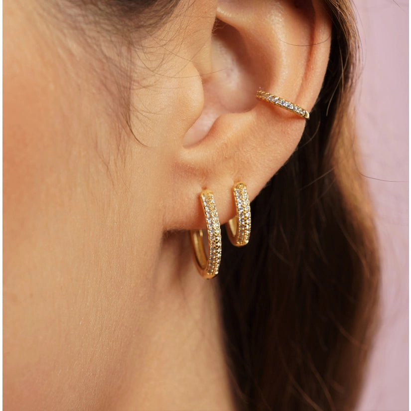 Introducing the elegant Kristin Hoops, a must-have addition to any fashion-conscious individual's collection. These hoops are made from high-quality 925 sterling silver and also come with a 18K gold-plated finish that adds a touch of luxury to your everyday wear.