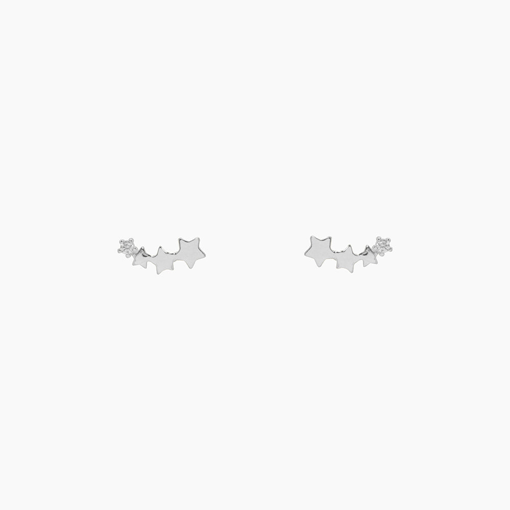 The earrings feature four shooting stars, with three in plain Sterling Silver and one crystal embellished star, creating a striking contrast that catches the eye. The versatile design allows you to wear them as a drop earring for a glamorous evening look or as an upward crawler for everyday wear, making them two styles in one!